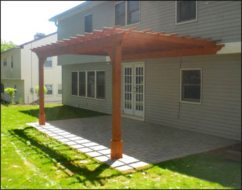 14 X 16 Cedar 2-Beam Wall Mounted Pergola shown with custom 2" x 10" Headers and Clear Stain/Sealer