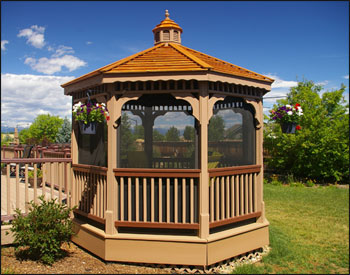 10 Treated Pine Octagon Gazebo Optional 2x2 railings, wavy fascia, and 4 track window system with screen door. Also shown with Customer Supplied Cedar slat roofing and Customers Paint.