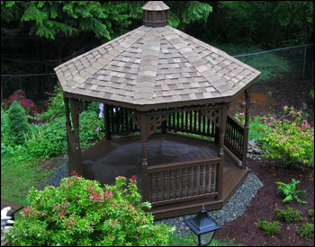 12 Cedar Octagon Gazebo shown with Cedar Deck, 2x3 Decorative Rails, Decorative Posts, Decorative Braces, 5 Bottom Railing Sections, Cedar Tongue and Groove Ceiling, Cedar Asphalt Shingles, 2 coats of Behr Premium Solid Padre Brown Stain (customer supplied)  