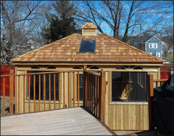 12 x 16 Cedar Rectangle Cabana shown with No Floor, Standard Single Door, No Shutters, No finished Interior, No Finished Ceiling, Cedar Shake Shingles, Cupola, Dome Skylight, and Sunburst Design Walls. 