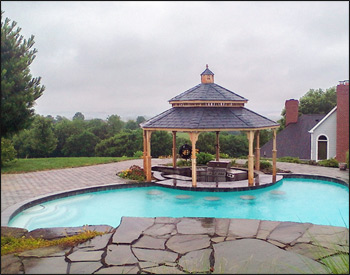 16 Cedar Octagon Double Roof Gazebo shown with no deck, no railings, straight posts, standard braces, no top railings, straight fascia, cupola, cedar tongue and groove ceiling, unstained, midnight gray rubber slate shingles, and hidden wiring w/ 1 receptacle & switch.