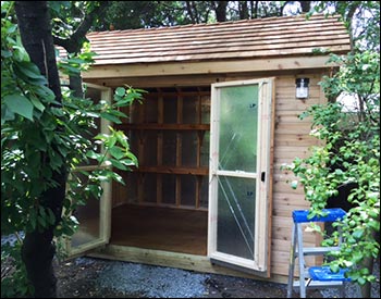 8 x 12 Cedar Tongue & Groove Gable Shed shown with Heavy Duty Pressure Treated Floor, Cedar Shake Shingles, Panelized Walls, 12" Taller Walls, 16" x 12 Shelf and a pair of Gable Vents.