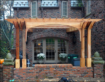 16 x 14 Custom Cedar Pergola shown with Wall Mount, Decorative Arch, 2x2 Top Runners with 12 Spacing, and Custom Braces