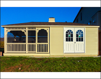 12 x 24 Vinyl Pool House shown with Ivory Vinyl Siding, Ivory Trim, Gray Composite Deck, Standard Railings, 2 - 18" x 36" Windows, 6 Sliding Glass Door & Double Door, Screens, Dual Brown Asphalt Shingles, & Cupola
