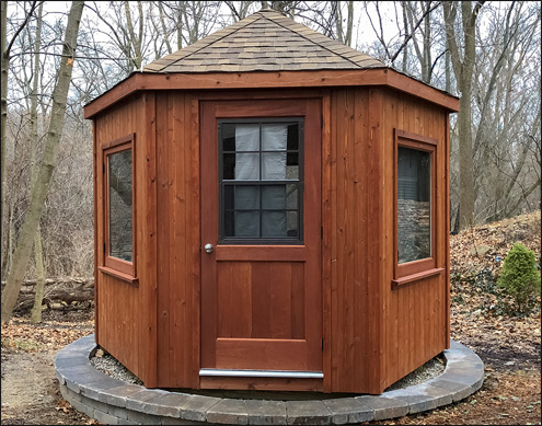 10 Cedar Hexagon Cabana shown with Customers Casement windows, Rustic Cedar Asphalt Shingles, and Cedar Tone Stain/Sealer.