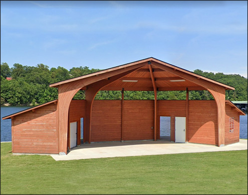 Custom Amphitheater Shown With glued laminated Arches, 2x8 T&G Roof Deck, factory stain, Log wall changing / storage rooms, back, and side walls and fiberglass shingle roofing.