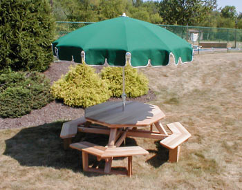 47" Unstained Trestle Table Shown w/ Optional Highback Chairs & 10 Green Market Umbrella 